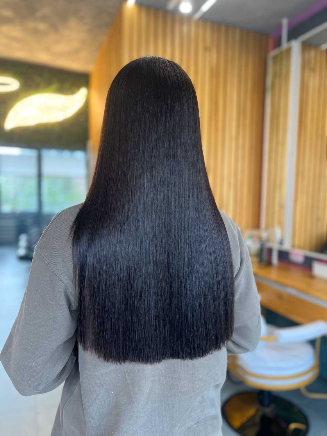 Sleek glossy long black hair blow dry